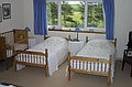 Two Single beds and a double bed in our Family room